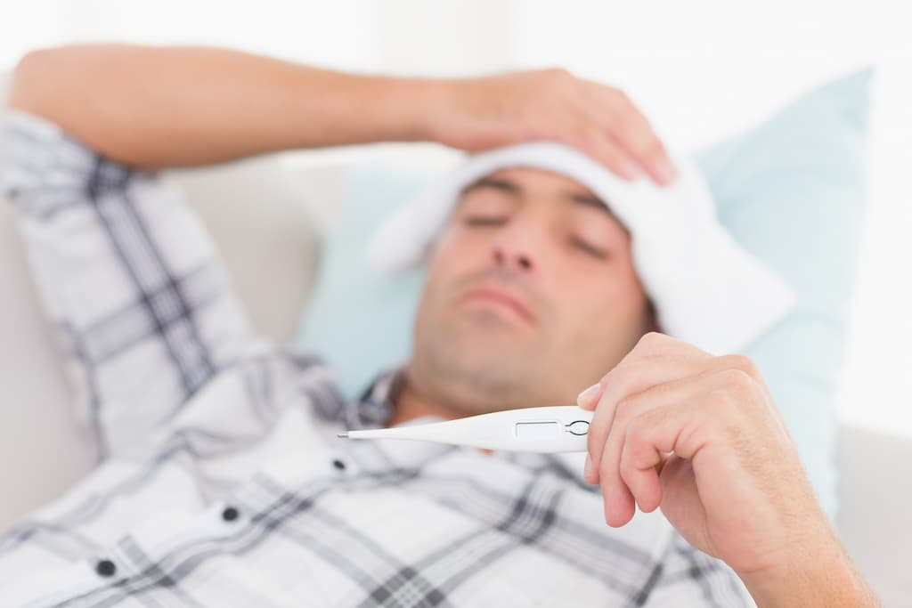 A man with a fever from an abscessed tooth infection